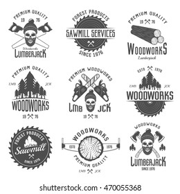 Lumberjack black white emblems with equipment forest products skull in hat with beard isolated vector illustration 