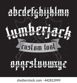 Lumberjack custom gothic alphabet font set on dark background of two old axes and wood chip. New modern vector typeface