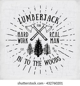 Lumberjack vintage label with two axes and trees. Hand drawn textured grunge vintage label, retro badge or T-shirt typography design, hipster T-shirt print design. Hand drawn vector illustration. 