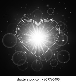 Luminous background with shining light. Romantic design with a bright glowing heart. 