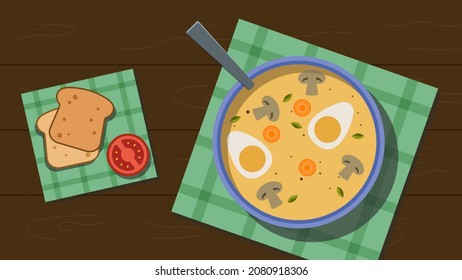 Lunch consisting of cream soup (includes mushrooms, eggs and carrots) and bread with tomato