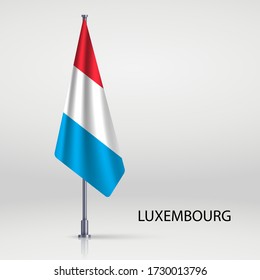 Luxembourg hanging flag on flagpole