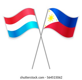 Luxembourgish and Filipino crossed flags. Luxembourg combined with Philippines isolated on white. Language learning, international business or travel concept.