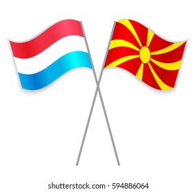 Luxembourgish and Macedonian crossed flags. Luxembourg combined with Macedonia isolated on white. Language learning, international business or travel concept.