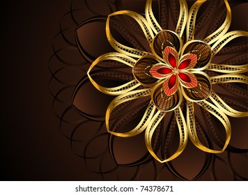 luxurious, abstract, golden flower on a dark chocolate - a brown background