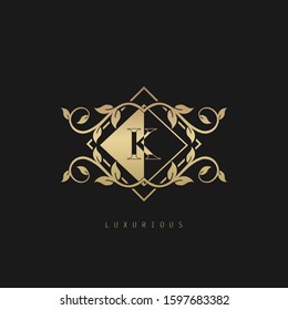Luxurious Classic Vintage Letter K logo. Vector logo design concept classic vintage geometrical polygon with nature leaves frame soft gold color.