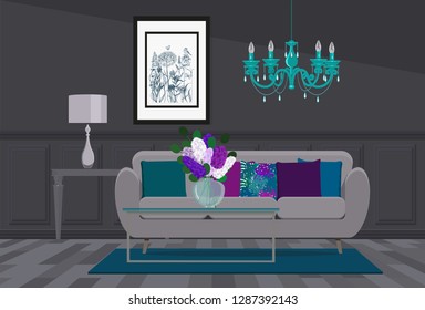 Luxurious gray interior design with turquoise chandelier, gray sofa and color pillows.