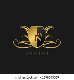 Luxurious  letter N Logo. Vector design concept golden luxurious shield  shape with letter logo icon for luxury business, initial or mor company identity.