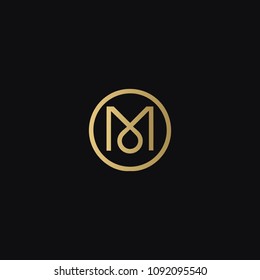 Luxurious modern elegant circular shaped M fashion brands black and golden color initial based letter icon logo