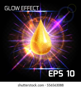 Luxury background with gold falling drop of oil, honey, bright iridescent glow in the rays of the lens effect, bright background of different colors on a dark background transparent.