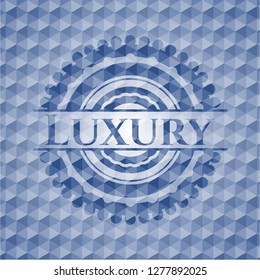 Luxury blue emblem with geometric pattern background.