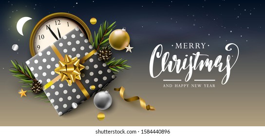 Luxury Christmas header or banner with black and yellow gift boxes, branches and baubles at night.