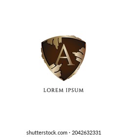 Luxury Decorative metallic gold shield sign illustration. Letter A alphabet logo design template. Initial abjad logo concept isolated on white background