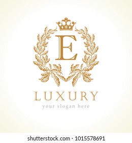 Luxury E letter and crown monogram logo. Laurel elegant beautiful round identity with crown and wreath. Vector letter emblem E for Antique, Restaurant, Cafe, Boutique, Hotel, Heraldic, Jewelry