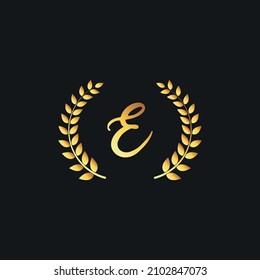Luxury E monogram alphabet letter golden laurel wreath vector logo design template