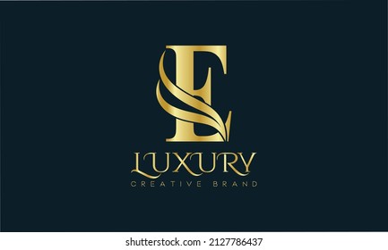 Luxury E monogram Classic Gold Lettering Typography Logo. Luxury decorative shiny vector illustration