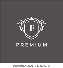 Símbolo de marco con logotipo inicial de lujo, diseño de monograma floral elegante y elegante de color oscuro