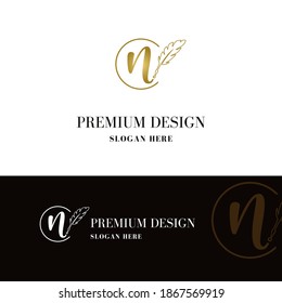 Luxury golden initial n letter with feather. Writing, art, copywrite business logo  concept