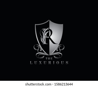 Luxury Guard R Letter Logo Icon. Silver R With Classy Shield Shape design perfect for fashion, Jewelry, Beauty Salon, Cosmetics, Spa, Hotel and Restaurant Logo. 
