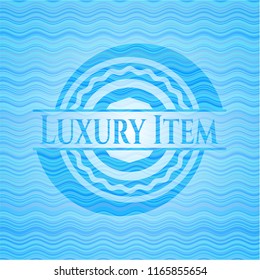 Luxury Item light blue water wave emblem.