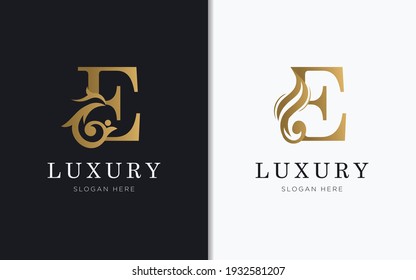 Luxury letter E with gold color logo template