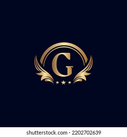 letra de lujo logotipo G estrella de oro real