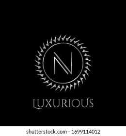 Luxury letter N Circle Logo vector design  silver color.