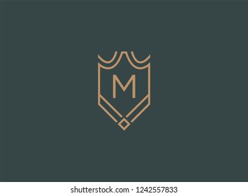 Luxury linear shield monogram letter M logo