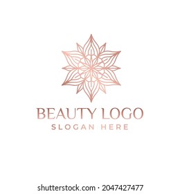 Luxury logotype in the shape of a flower for antique boutique. Gold logo, flower. Simple geometric sign. Icons, business, invitations. Volumetric golden big bud. Vintage.