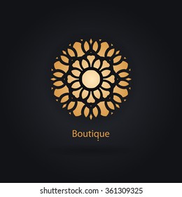 Luxury logotype in the shape of a flower for antique boutique. Gold logo, flower. Simple geometric sign. Icons, business, invitations. Volumetric golden big bud. Vintage. Islam, Arabic, Indian. Retro.