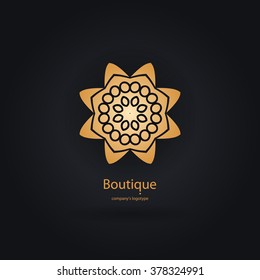 Luxury logotype in the shape of a flower for antique boutique. Gold logo, flower. Simple geometric sign. Icons, business, invitations. Volumetric golden big bud. Vintage. Islam, Arabic, Indian. Retro.