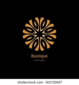 Luxury logotype in the shape of a flower for antique boutique. Gold logo, flower on black background. Simple geometric sign. Icons, business, invitations. Volumetric golden big bud. Vintage. Retro.