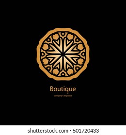 Luxury logotype in the shape of a flower for antique boutique. Gold logo, flower on black background. Simple geometric sign. Icons, business, invitations. Volumetric golden big bud. Vintage. Retro.