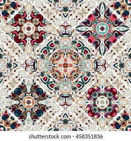 Luxury oriental tile seamless pattern. Colorful floral patchwork background. Mandala boho chic style. Rich flower ornament. Rhomb design elements. Portuguese moroccan motif. Unusual flourish print.