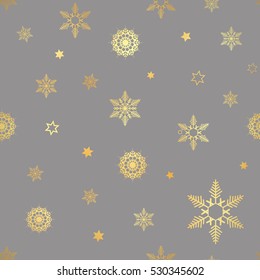 luxury seamless pattern with gold snowflakes on a dark background