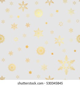 luxury seamless pattern with gold snowflakes on a white background