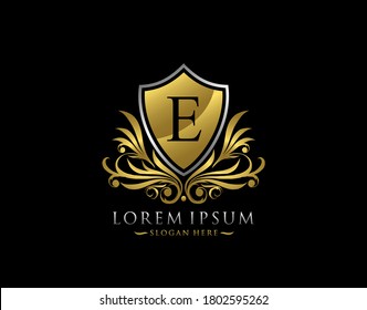 Luxury Shield E Letter Logo. Graceful Elegant gold shield icon design.  