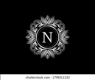 Luxury Silver Badge N Letter Logo. Luxury calligraphic vintage emblem with beautiful classy floral ornament. Vintage Heraldic Frame design Vector illustration.