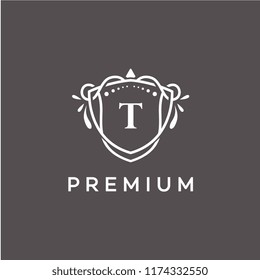 Luxury T Initial Logo frame symbol, Luxury and graceful floral monogram design dark background