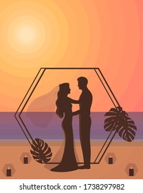 Luxury Tropical Beach Wedding. Romantic Silhouette of a Couple, Arch Decorated With Monstera Leaves and Candles Aisle at Sunset. Beautiful Newlyweds Looking at Each Other, Hugging by the Sea