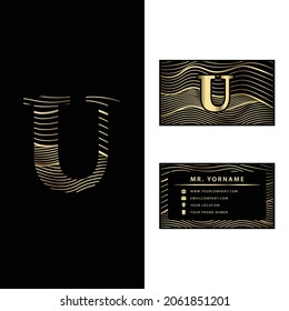 Luxury U vector logotype with business card template. 
Premium letter U logo with golden wave line style. 
Elegant corporate identity.