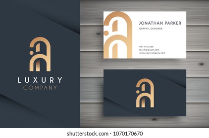 Luxury vector logotype with business card template. Premium letter A logo with golden design. Elegant corporate identity.