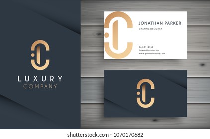 Luxury vector logotype with business card template. Premium letter C logo with golden design. Elegant corporate identity.