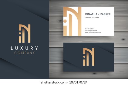 Luxury vector logotype with business card template. Premium letter N logo with golden design. Elegant corporate identity.