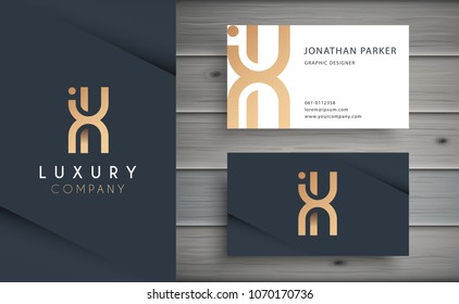 Luxury vector logotype with business card template. Premium letter X logo with golden design. Elegant corporate identity.