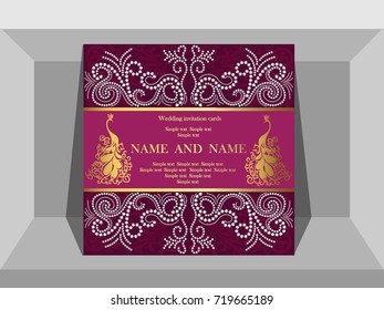 Luxury wedding invitation card with peacock jewelry.