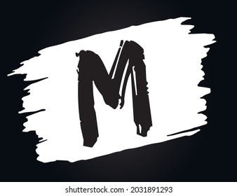 M - Alphabet with brush effect and black background.