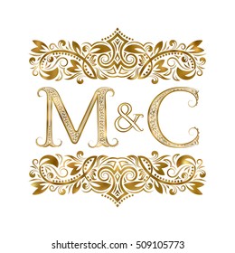 M and C vintage initials logo symbol. The letters are surrounded by ornamental elements. Wedding or business partners monogram in royal style.