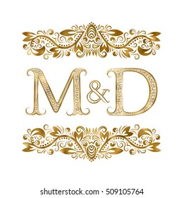 M and D vintage initials logo symbol. The letters are surrounded by ornamental elements. Wedding or business partners monogram in royal style.