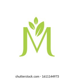 M green letter with three leaf logo design